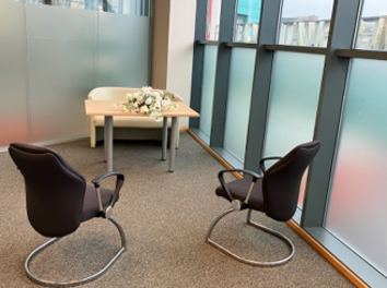 Paignton registrar office with 2 chairs and table