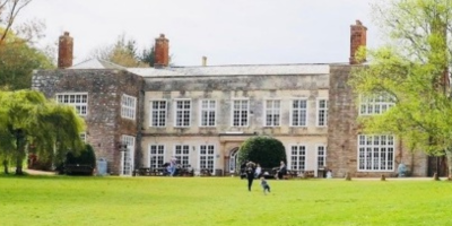 Cockington Court within the grounds.