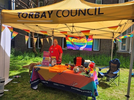 Annette Fostering and Events Co-ordinator under a gazebo at Exeter Pride event